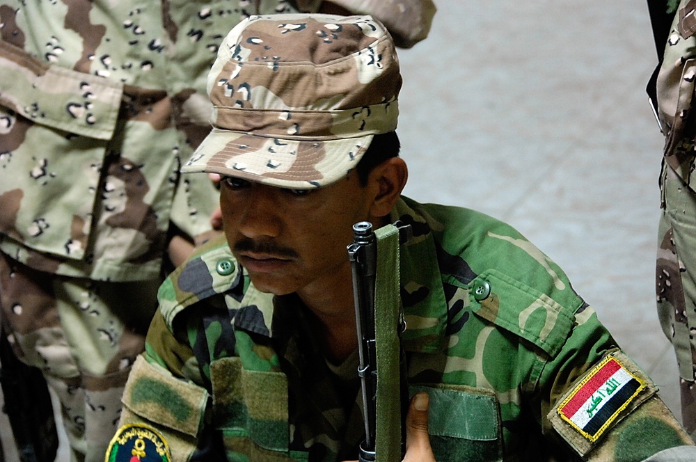 Iraqi Marines and British Soldiers Patrol Port