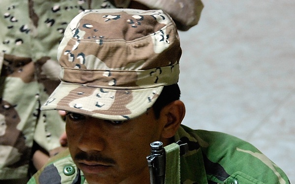 Iraqi Marines and British Soldiers Patrol Port