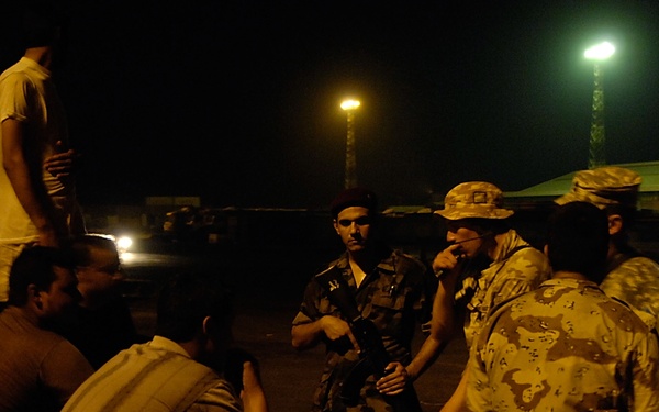 Iraqi Marines and British Soldiers Patrol Port