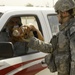 U.S. Soldiers Hand Out Stuffed Animals