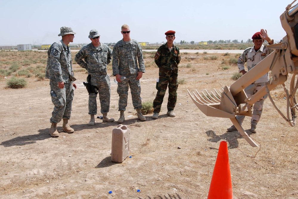 Iraqi Army receives mine detection vehicle instruction from 10th Mtn. Soldiers