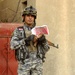 Iraqi national police hand out leaflets