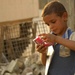 Iraqi national police hand out leaflets