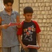 Iraqi national police hand out leaflets