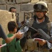 Iraqi national police hand out leaflets