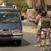 Iraqi Soldiers Hand Out Wanted Posters