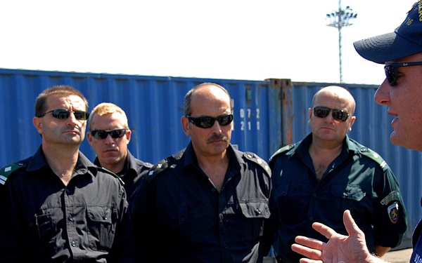 Sailor Explains U.S. Coast Guard vessel boarding and inspection procedures to Bulgarian Border Policemen