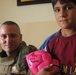 Iraqi children play soccer; Remember hero