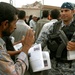 Iraqi National Police Hand Out Baghdad Now Papers