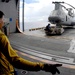 Moving a helicopter aboard the USS Iwo Jima