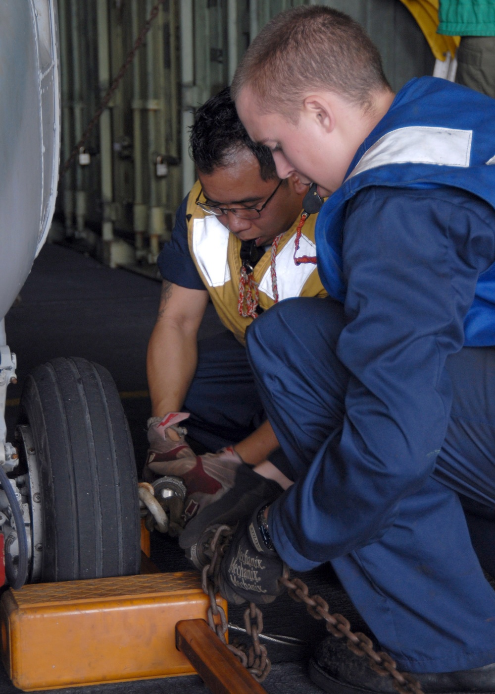 Moving a helicopter aboard the USS Iwo Jima