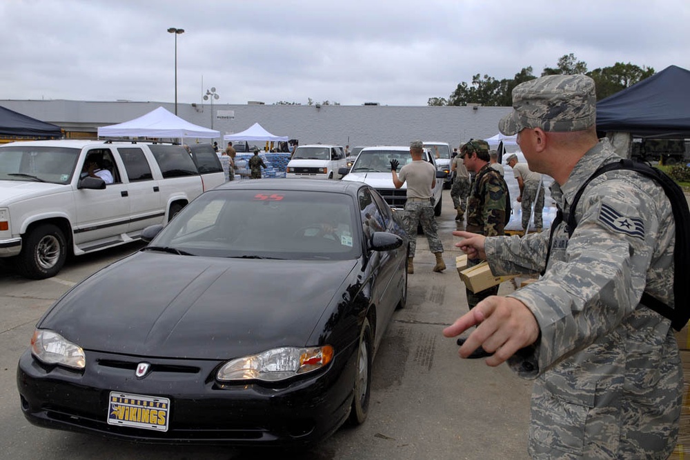 Louisiana National Guardsmen distribute supplies to residents
