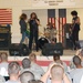 Classic rock 'n' roll band visits CAB, rocks Camp Taji