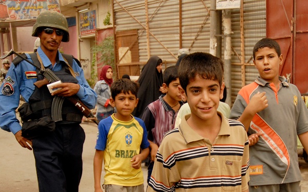 Iraqi Police and 4th ID Soldiers Patrol the Streets of Abu Tshir