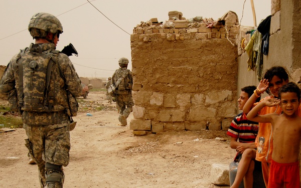 Iraqi Police and 4th ID Soldiers Patrol the Streets of Abu Tshir