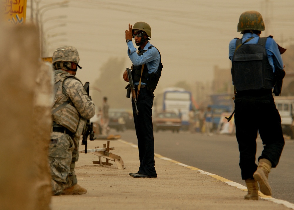 Iraqi Police and 4th ID Soldiers Patrol the Streets of Abu Tshir