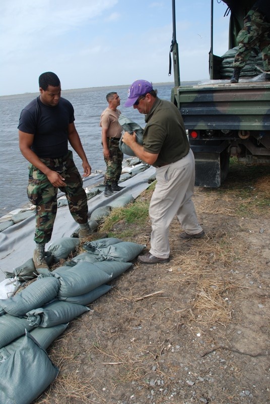 National Guard sandbags levee, protects highway