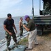 National Guard sandbags levee, protects highway