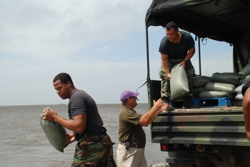 National Guard sandbags levee, protects highway