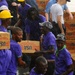 USS Kearsarge service members, Haitian citizens load hurricane relief supplies