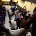 USS Kearsarge service members, Haitian citizens load hurricane relief supplies