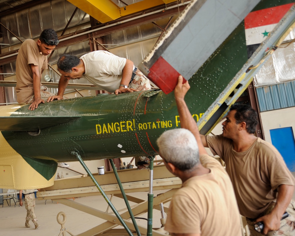 Iraqi Air Force Perform Maintenance Inspection on MI-17 Helicopter