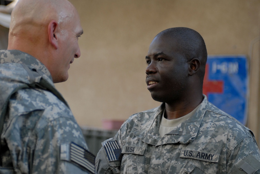 Phoenix Soldiers presented coin by new MNF-I CG