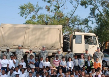 Second-graders High-five Soldiers' Helping Hands