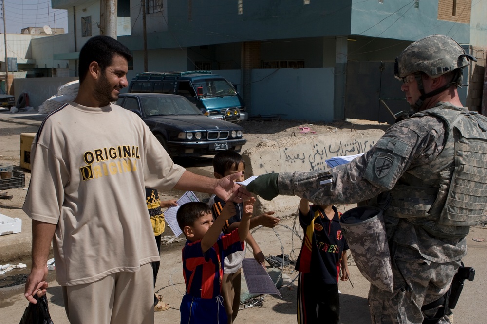 U.S. Marines Distribute Pamphlets