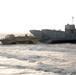 Light amphibious re-supply cargo vehicle delivers hay to stranded cows on Galveston beach