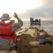 Light amphibious re-supply cargo vehicle delivers hay to stranded cows on Galveston beach