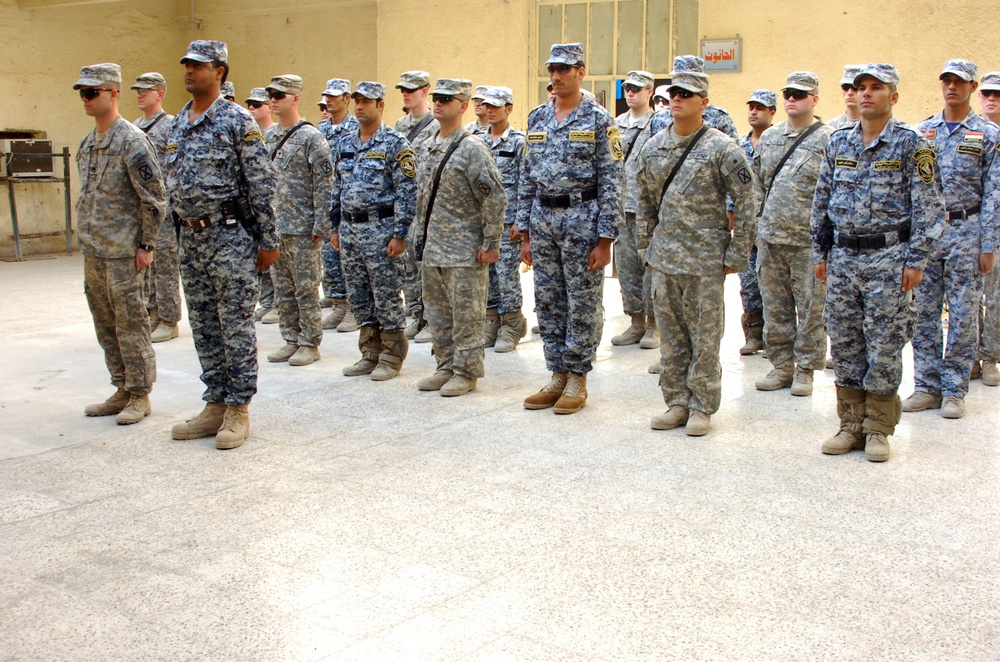 National Police Command Sergeant Major Presented $1,000 Award From Team Iraqi Security Forces Partners