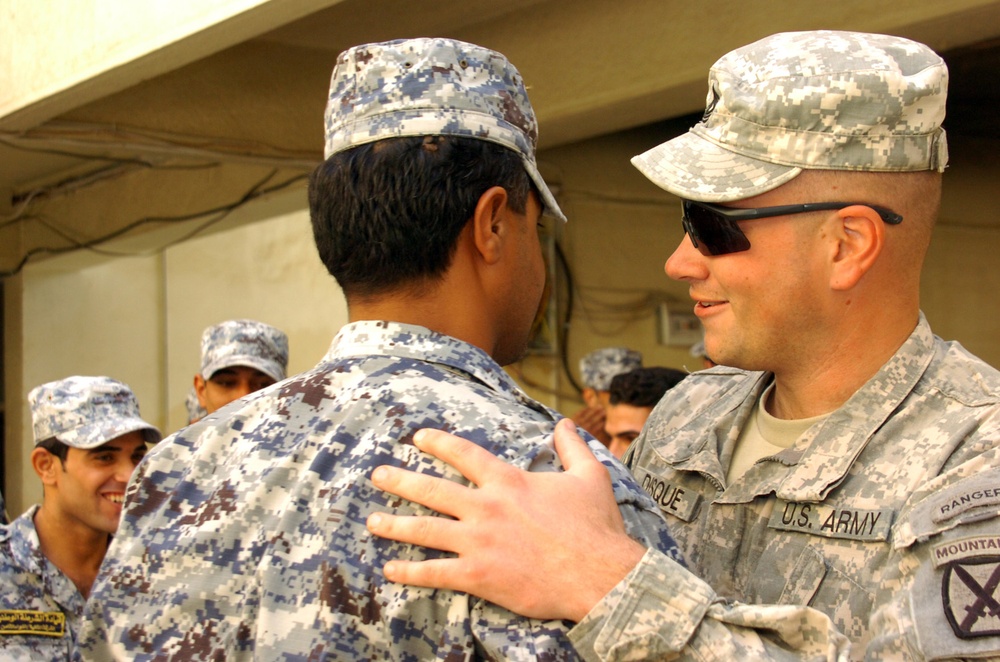 National Police Command Sergeant Major Presented $1,000 Award From Team Iraqi Security Forces Partners