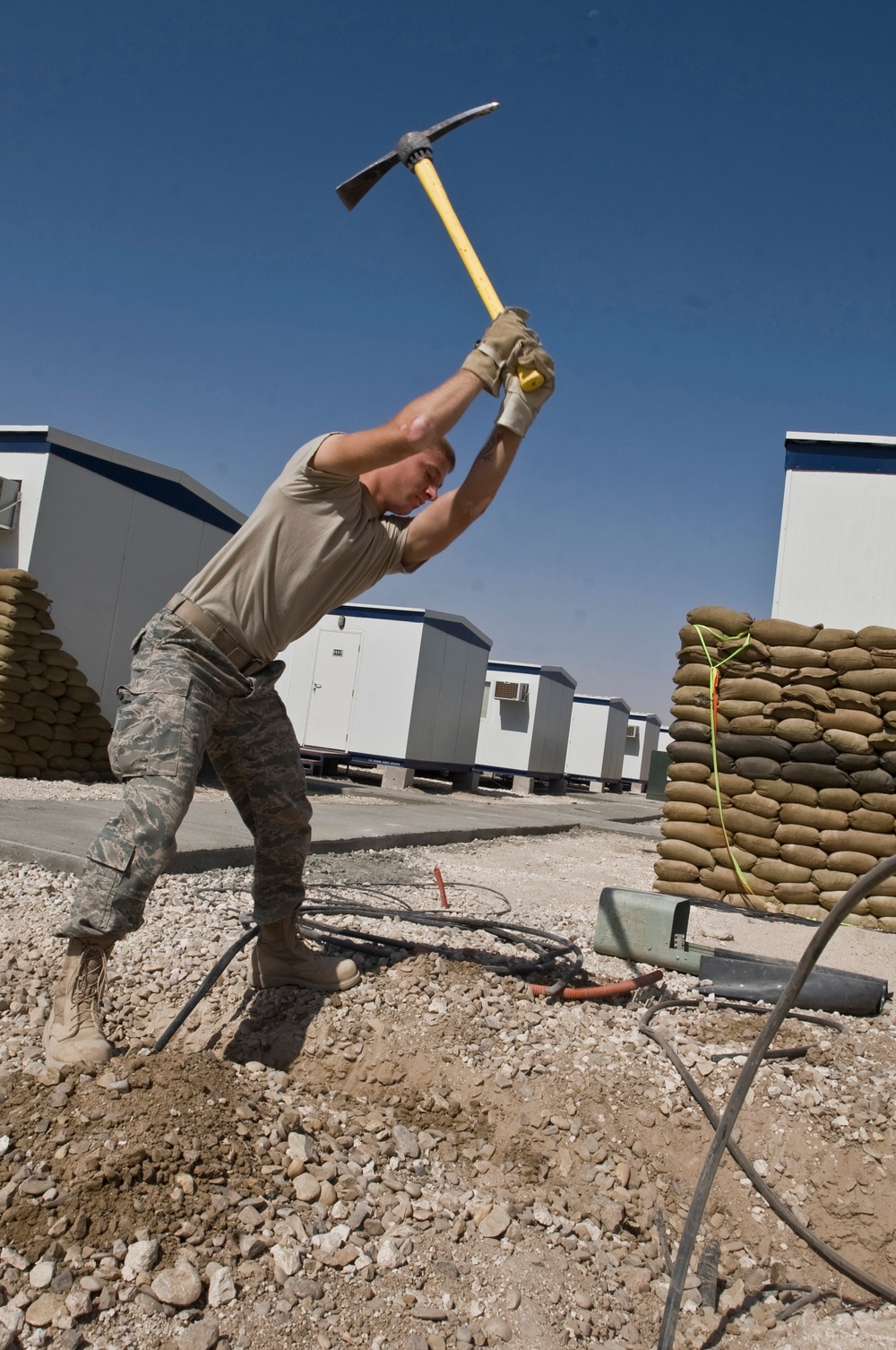407th Expeditionary Communications Squadron Installs telephone connections for Phase two trailers