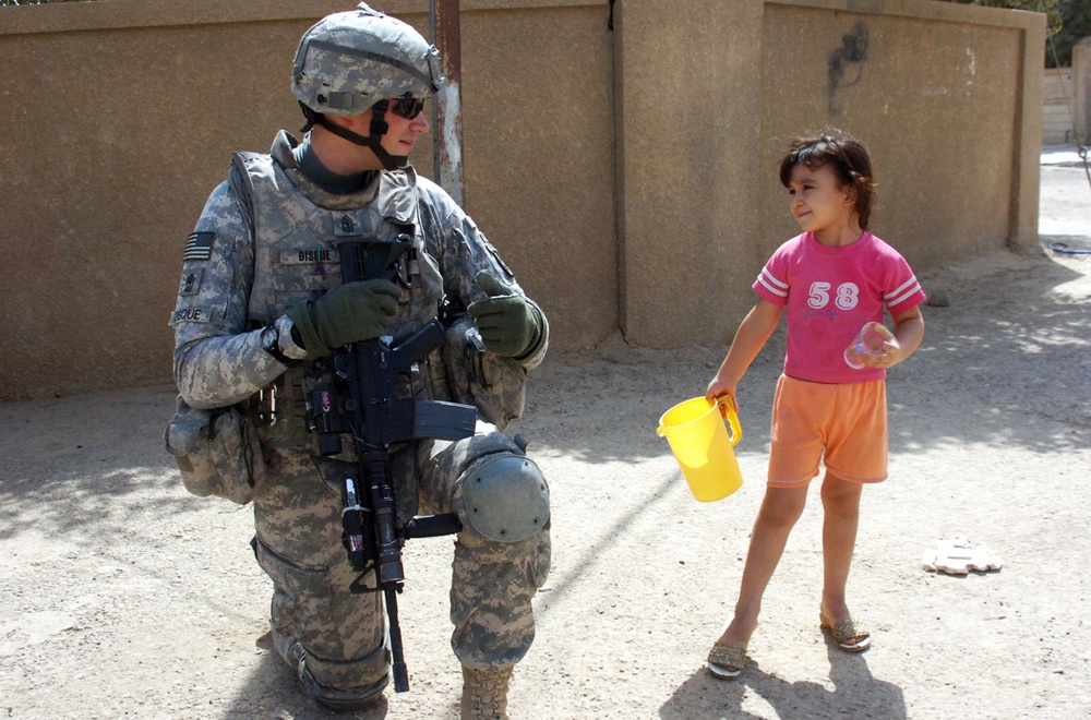 National Police, 2-30th Inf. Regt. Soldiers clear Baghdad streets of concertina wire