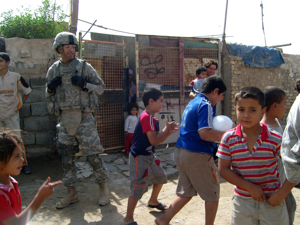 2nd Platoon issues soccer balls to &quot;Shanty Town&quot;