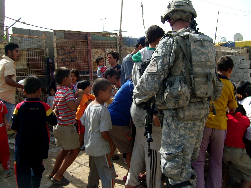 2nd Platoon issues soccer balls to &quot;Shanty Town&quot;