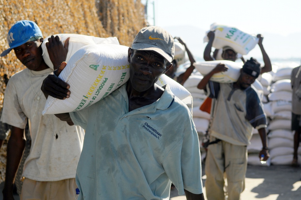 Haitian citizens unload relief supplies