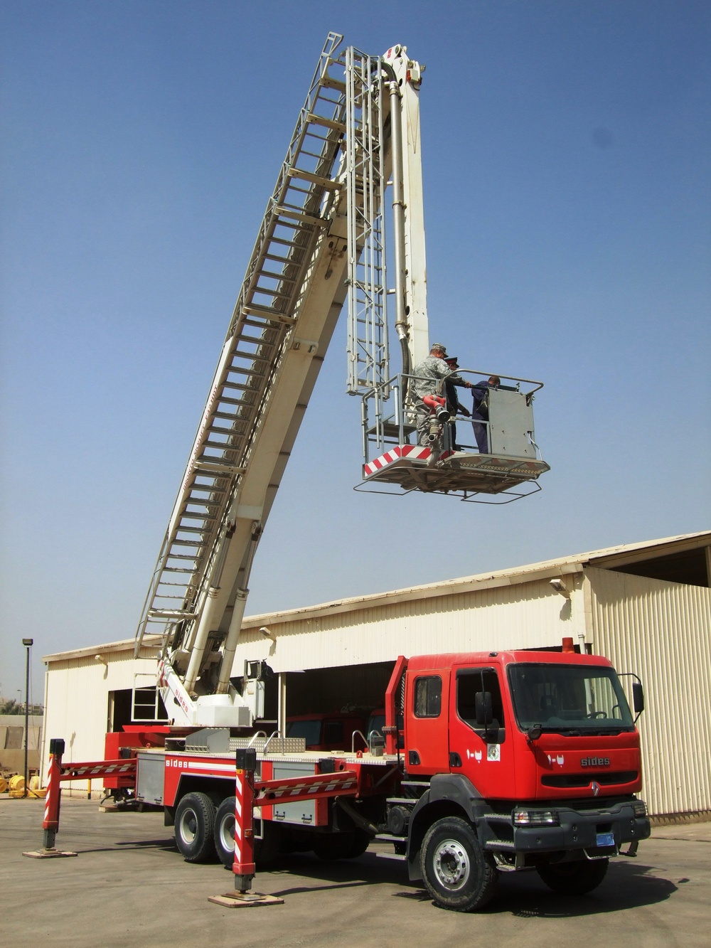 NY Firefighter delivers new ladder truck to IZ FD