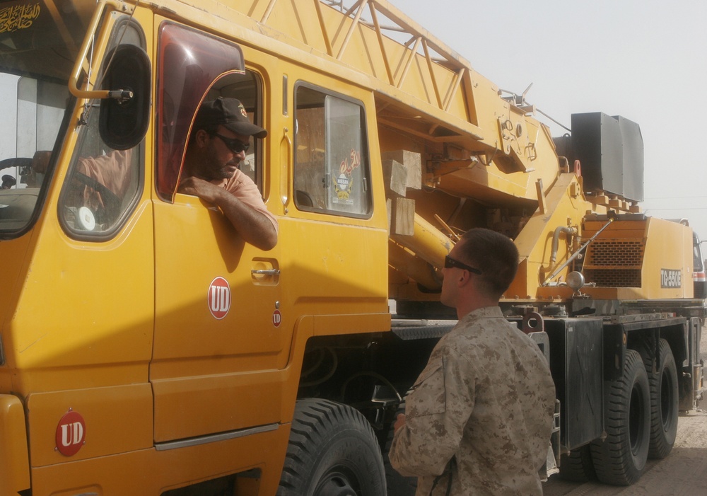 Combat Engineer Tears Down Barriers With Iraqis