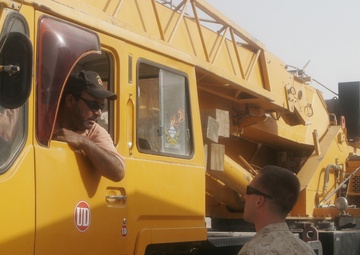 Combat Engineer Tears Down Barriers With Iraqis