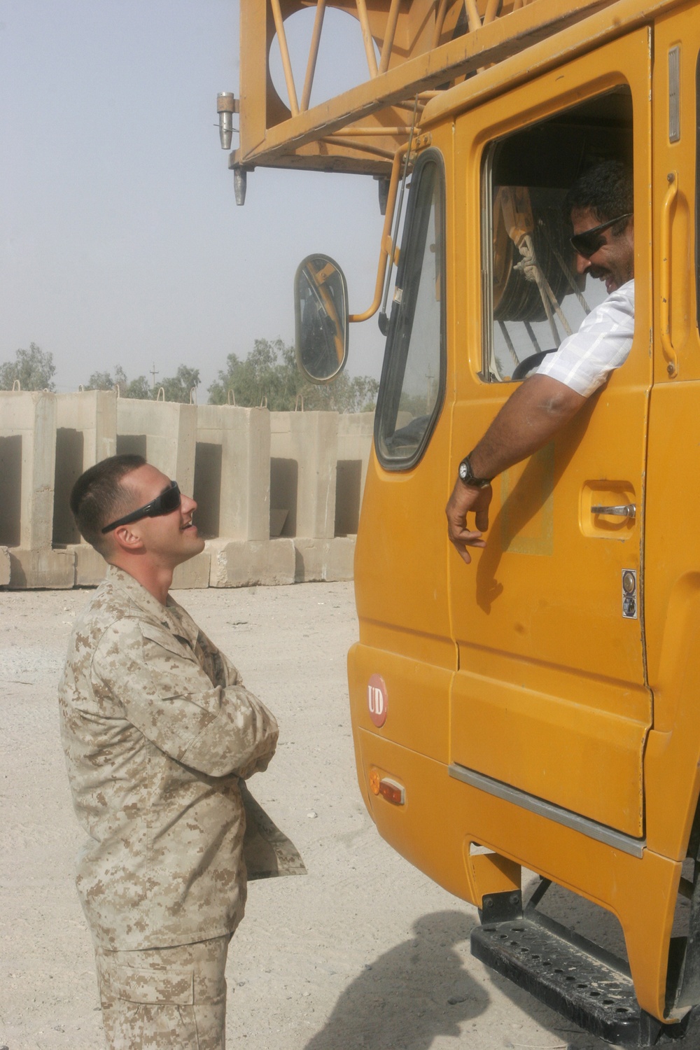 Combat Engineer Tears Down Barriers With Iraqis