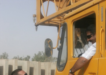 Combat Engineer Tears Down Barriers With Iraqis