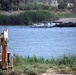Rhinos use heavy equipment for bridge construction