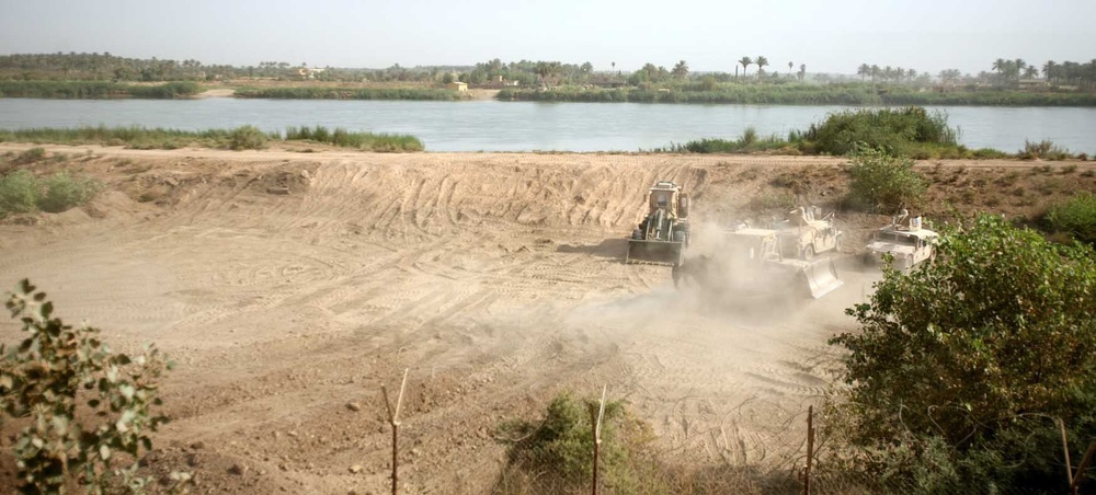 Rhinos use heavy equipment for bridge construction