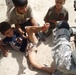 Patrol stops, applies first aid to Iraqi boy