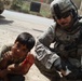 Patrol stops, applies first aid to Iraqi boy