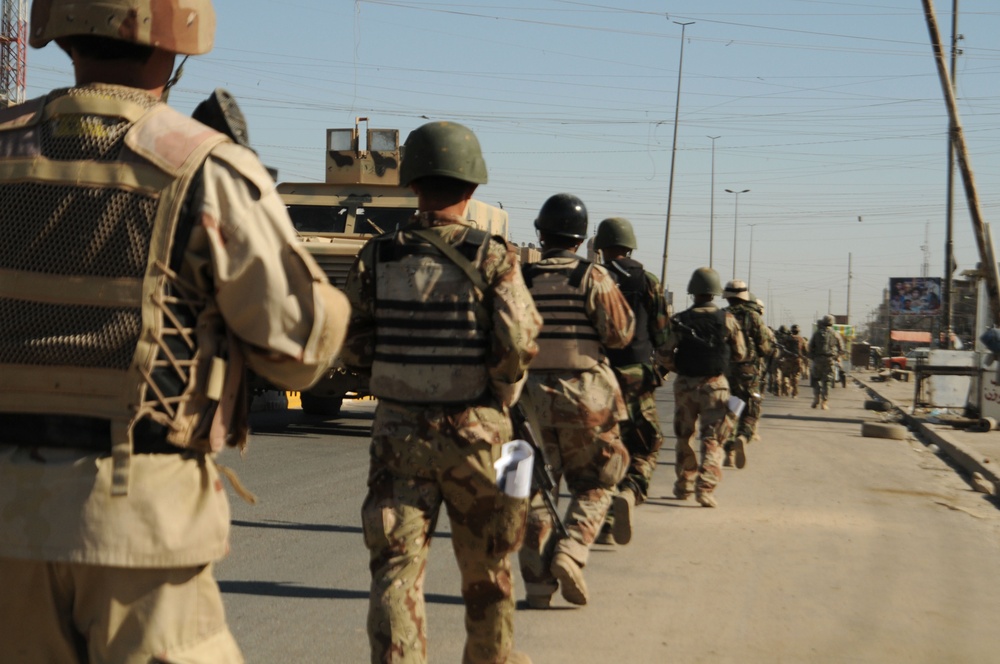 Iraqi Soldiers Distribute Information Pamphlets