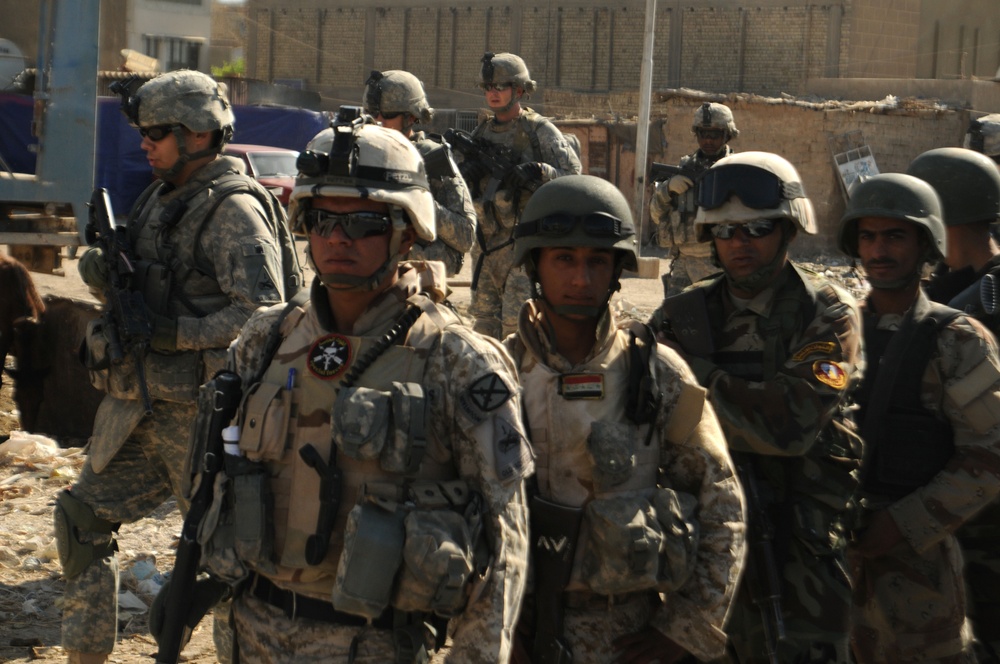 Iraqi Soldiers Distribute Information Pamphlets