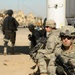 Iraqi Soldiers Distribute Information Pamphlets